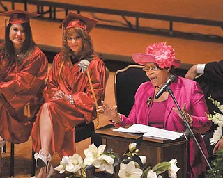 Keynote speaker Sarah Brown-Clark, Youngstown municipal clerk of courts, told the 2011 Chaney High School graduates not to depend on anyone else for their happiness. Seated next to her are salutatorian Jennifer Caventer, left, and valedictorian Kaitlyn Cook.