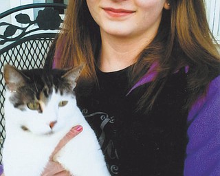 Kathryn Pontius of Austintown says Cream Puff, 3, is special because she and her mom were strays.