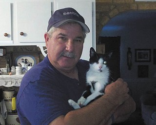 My name is Winky because I was born with only one eye. I am 3 ears old and have a "heart" on my chest and "Mickey Mouse ears" on my paw. Someone abandoned me in a railroad yard. I had to live on birds and rodents. Winter came and it was a very cold winter. I found some shelter in a large pipe. The pipe was not warm enough, and I left to find a warmer place. I did not find one, and I began to freeze. A nice man saw me frozen in the snow and took me to a building. He fed me, too, and, boy, was I hungry! I soon warmed up and went on my way. I saw this nice man often, and he would whistle for me. I would stop what I was doing and run to him because I knew he would have a piece of chicken for me. One day this nice man decided to take me home! I now live with a family with two Maltese dogs. I have lived here now for 2 years. I am very happy, and I am a good cat because I know I was given a second chance. I spend my day playing (gently) with the two dogs and looking out my favorite window. My rescuer is Mickey Drabison, Youngsown.