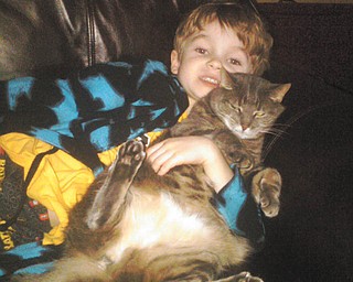 Richard Blair of Boardman sent this picture of his son, Rick, with their cat, Nora. Nora is 9, and the family adopted her in 2002.