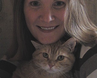 Carole Sharp of Austintown says: "After volunteering for Angels for Animals, a 5-year-old orange tabby chose me this February. His name is Romeo, and he came into our home with two boys, a dog from the pound, a rescued retriever and another cat, also from the shelter, to play with. I thought he chose me, but when I brought him home, he chose my husband instead. I've heard you don't choose the cat. The cat chooses you. I believe it now. The one who chooses you is the one who really wants to stay by your side. Rescued cats seem to be more affectionate and really crave attention that warms your heart. Our other cat is his best friend, and they play together all the time. Seeing what I see now, I'll never have just one. I never realized how lonely our cat was until we brought Romeo home. They really need companions, just like us."