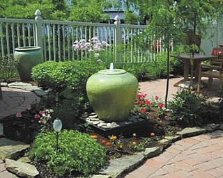 The Columbiana Women’s Club has scheduled its annual Alice in Wonderland Tea and Garden Tour for June 17 and 18. One of the stops on this year’s tour is the garden at Barley Twists Antique Shop, owned by Alfie and Barb Farrand.