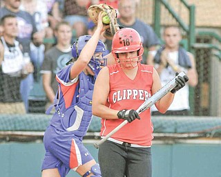 Columbiana's #18 Claire Brothers walks of the field after being the final strikeout of the game while Crestview catcher #17 Jessica Burger celebrates.