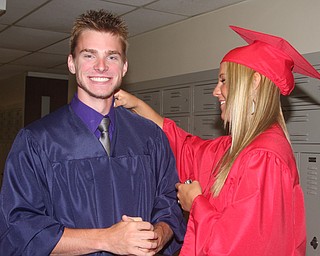 FITCH - Eric Vereb is all smiles as Kellie Wenick helps get him ready for graduation Saturday morning at Fitch. - Special to The Vindicator/Nick Mays