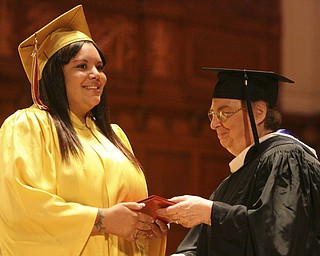 ROBERT K. YOSAY | THE VINDICATOR --..Brooklyn native Najah Morgan receives her diploma from Siter Jane Marie - principal - Cardinal Mooney's 53 Annual Commencement at Stambaugh Auditorium . -30-..(AP Photo/The Vindicator, Robert K. Yosay)