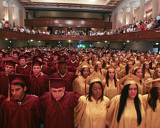 ROBERT K. YOSAY | THE VINDICATOR --..Arm in Arm... the senior class sings the alma mater one last time as a group---Cardinal Mooney's 53 Annual Commencement at Stambaugh Auditorium . -30-..(AP Photo/The Vindicator, Robert K. Yosay)