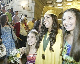 William d Lewis the Vindicator Ursuline graduate Paige Larney is flanked by her sisters Jade, 13, left and Brooke, 15, after the Satyrday ceremony at Stambaugh Auditorium.