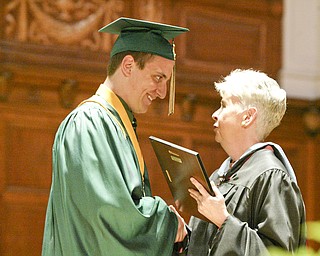 William d LEwis the Vindicator Ursuline Valedictorian Matthew Metzinger is cdongratulated by principal Patricia Fleming during Saturday commencement at Stambaugh Auditorium