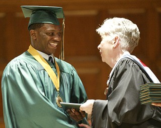 William d Lewis the Vindicator Ursuline grad and football standout Akise Teague gets diploma from principal Patricia fleming during Saturday commencement at Stambaugh Auditiorium