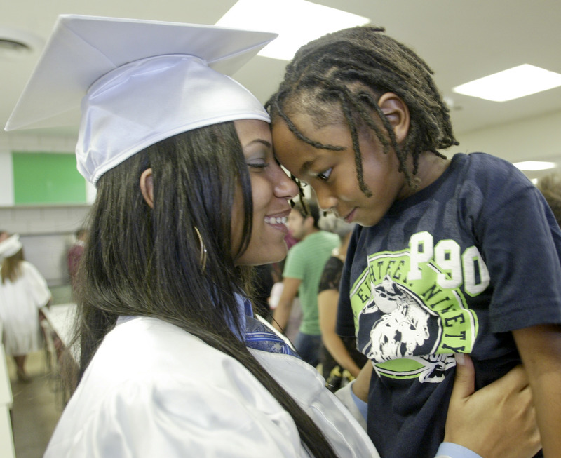 William D Lewis The Vindicator  Boardman HS grad Shavai Owens, one of 6 wounded in Febuary shooting near YSU, hugs her brother Dinari Ferguson, 4, after commencement which was held Sunday at the HS.