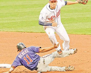 Cleveland Indians shortstop Asdrubal Cabrera, top, looks toward first base after forcing Ben Revere out at second base in the fifth inning in a baseball game, Monday, June 6, 2011, in Cleveland. Alexi Casilla was out at first base for the double play. (AP Photo/Tony Dejak)