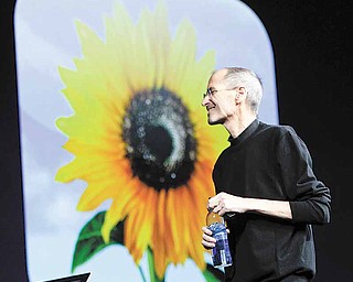 Apple CEO Steve Jobs gives the keynote address to the Apple Worldwide Developers Conference in San Francisco, Monday, June 6, 2011. (AP Photo/Paul Sakuma)