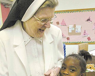 Unique Moore is shown here in this July 2010 photo with Sister Jerome Corcoran at an event at Millcreek Children’s Center in Youngstown. The 5-year-old died Monday in Akron Children’s Hospital, Akron, where she was taken after being pulled Sunday afternoon from Willow Lake Park campground swimming pool in Champion Township in Trumbull County.