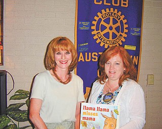 Sharing the knowledge: Elaine Bozick, a past president of the Rotary Club of Austintown, at left, spoke to the club recently about being Ohio team leader for a Group Study Exchange. In the most recent GSE program, young businesspeople and professionals traveled to the Philippines to visit vocational exchange partners, Rotary International District 3820 in the region southeast of Luzon. The program is directed by the Rotary Foundation, whose mission is to enable Rotarians to advance global understanding, good will and peace. At right is Susan Leetch, president of the Austintown Rotary.