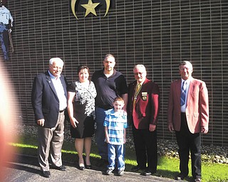 Shriners are there for children: Members of the Youngstown Shrine Club received thanks from the Blakeman family, of Boardman, for its donation of a state-of-the-art neuromuscular stimulator to help young Rio Blakeman walk more normally and have a good experience in school. Rio has a range of motion disability and needs the stimulator, a new technology that most insurances do not yet cover. From left to right are Steve Withers, on the Board of Governors of Shriners Hospital for Children, in Erie; Julie Blakeman, Dan Blakeman, Rio, Jay Jones, president of the Youngstown Shrine Club; and John Miller, director of children services for the Youngstown club. The Youngstown Shrine Club supports both the Erie hospital and the Cincinnati Children’s Hospital for burns. The Youngstown Shrine Club provides financial support and free transportation for children and their families to all 22 Shrine hospitals.