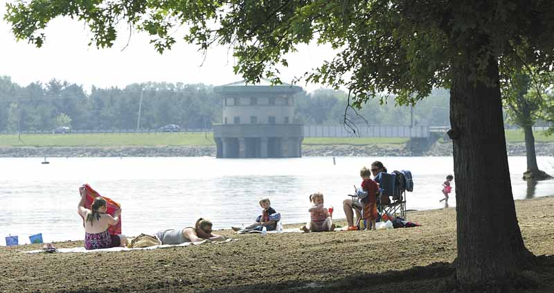 High temperatures gave Mahoning Valley residents a reason to hit the water. Cousins Zakary Smith, 5, left, and Koltyn Poling, 6, both of Niles, cooled off Wednesday at Mosquito Lake State Park in Trumbull County. 
