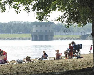 High temperatures gave Mahoning Valley residents a reason to hit the water. Cousins Zakary Smith, 5, left, and Koltyn Poling, 6, both of Niles, cooled off Wednesday at Mosquito Lake State Park in Trumbull County.