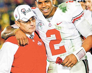 FILE-This Jan. 1, 2010 file photo shows Ohio State head coach Jim Tressel, left, and MVP Terrelle Pryor celebrating after winning the Rose Bowl NCAA college football game against Oregon in Pasadena, Calif. The Ohio State quarterback, full of potential but surrounded by controversy, announced through his attorney on Tuesday June 7, 2011, that he would give up what remained of his senior season. (AP Photo/Mark J. Terrill,File)