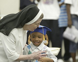 Unique Moore, a preschool student at Mill Creek Children's Center, died recently in a swimming accident. She was remembered during a graduation ceremony at the center.