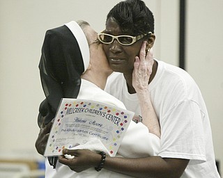 Unique Moore, a preschool student at Mill Creek Children's Center, died recently in a swimming accident. She was remembered during a graduation ceremony at the center.