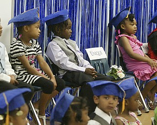 Unique Moore, a preschool student at Mill Creek Children's Center, died recently in a swimming accident. She was remembered during a graduation ceremony at the center.
