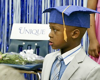 Unique Moore, a preschool student at Mill Creek Children's Center, died recently in a swimming accident. She was remembered during a graduation ceremony at the center.