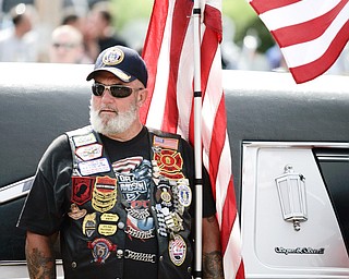 NEW CASTLE, PA - JUNE 11: War Veterans line the sidewalks with American flags outside Ed & Don DeCarbo Funeral Home to honor Staff Sgt. Edward Mills Jr. on June 11, 2011 in New Castle, PA. (photo by: Justin K. Aller)