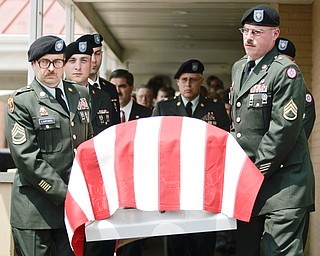 NEW CASTLE, PA - JUNE 11: The honor guard carries the flag-draped casket of Staff Sgt. Edward Mills Jr. to the hearse on June 11, 2011 in New Castle, PA. (photo by: Justin K. Aller)