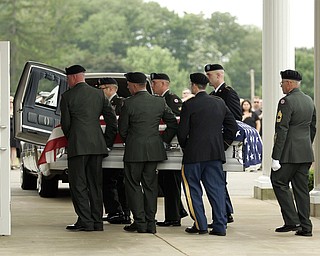 NEW CASTLE, PA - JUNE 11: The honor guard carries the flag-draped casket of Staff Sgt. Edward Mills Jr. into the mausoleum on June 11, 2011 in New Castle, PA. (photo by: Justin K. Aller)