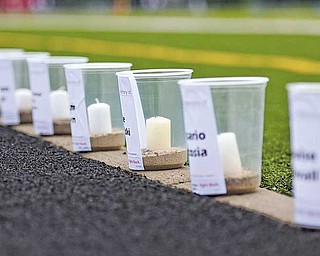 Candles lined the track at Fitch High School Friday night for the start of the 12th annual Austintown Relay For Life. Four million people worldwide were expected to participate in this year’s event, which raises money for cancer research and education.