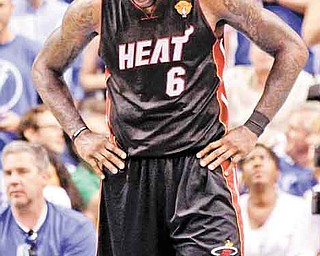 Miami Heat's LeBron James (6) holds his head down during the second half of Game 5 of the NBA Finals basketball game against the Dallas Mavericks Thursday, June 9, 2011, in Dallas. The Mavericks won 112-103 to take a 3-2 lead in the series. (AP Photo/David J. Phillip)