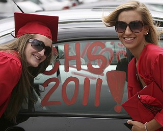 ROBERT K. YOSAY | THE VINDICATOR --..Stopping for a memory are Cally Wollet and Nikki Calai at Canfield High School 2011 graduation at the Stadium - .. -30-..(AP Photo/The Vindicator, Robert K. Yosay)