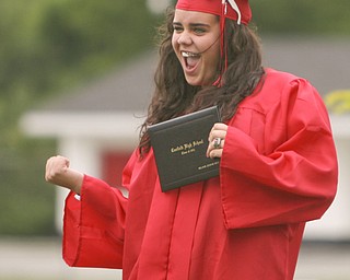 ROBERT K. YOSAY | THE VINDICATOR --..Yeeahhh Melanie jeanine West reacts to her diploma -- for family and friends.--Canfield High School 2011 graduation at the Stadium - .. -30-..(AP Photo/The Vindicator, Robert K. Yosay)