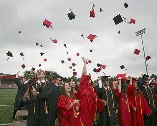 ROBERT K. YOSAY | THE VINDICATOR --..THEY ARE DONE as the Class of 2011 toss their hats at the end of the ceremony -- Canfield High School 2011 graduation at the Stadium - .. -30-..(AP Photo/The Vindicator, Robert K. Yosay)