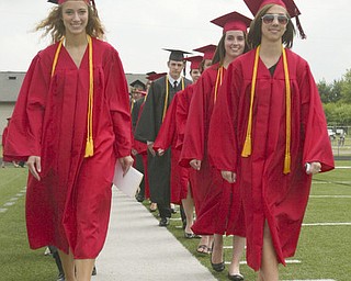 ROBERT K. YOSAY | THE VINDICATOR --..Long white walk as Daniel Marie Goddard and Emily Gleichert leads the class of 2011 on the stadium -Canfield High School 2011 graduation at the Stadium - .. -30-..(AP Photo/The Vindicator, Robert K. Yosay)