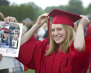 ROBERT K. YOSAY | THE VINDICATOR --..Still pretty as a picture --Leanna Hartsough the and now as she imitates her graduation from pre school and now as a graduate of Canfield High School -Canfield High School 2011 graduation at the Stadium - .. -30-..(AP Photo/The Vindicator, Robert K. Yosay)