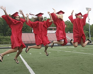 ROBERT K. YOSAY | THE VINDICATOR --..CELEBRATE - Katie Tiberio Nicole Tiberio Jenna George and Lauren Boucherle -celebrate together at Canfield High School 2011 graduation at the Stadium - .. -30-..(AP Photo/The Vindicator, Robert K. Yosay)