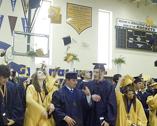 William D Lewis the Vindicator Lowellville HS 2011commencement ceremony Sunday at Lowellville HS. Grads toss their caps at end of ceremony.