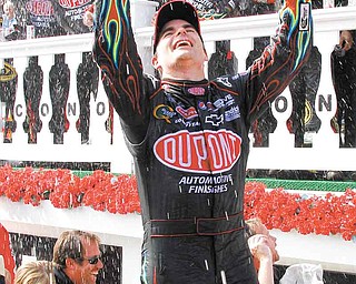 Jeff Gordon celebrates in victory lane after winning the NASCAR Sprint Cup Series auto race, Sunday, June 12, 2011, in Long Pond, Pa. (AP Photo/Russ Hamilton Sr.)