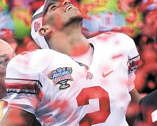 Ohio State quarterback Terrelle Pryor celebrates amid confetti following Ohio State's 31-26 win over Arkansas in the Sugar Bowl NCAA college football game at the Louisiana Superdome in New Orleans, Tuesday, Jan. 4, 2011. (AP Photo/Dave Martin)