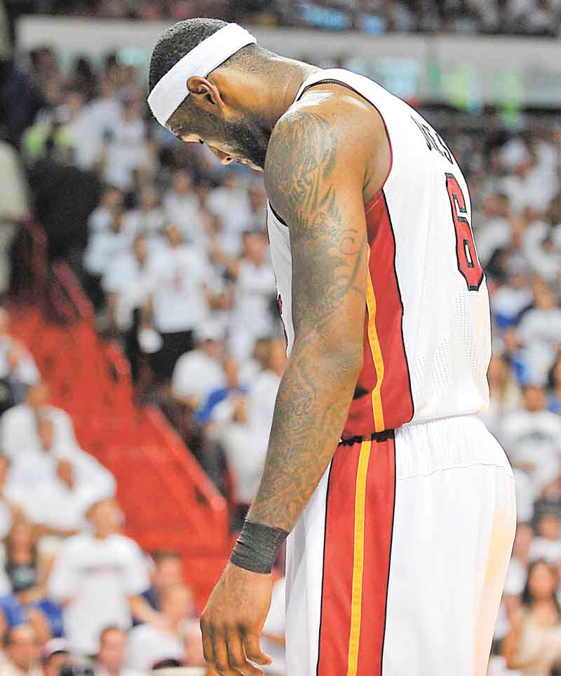 LeBron James of the Heat hangs his head during the third quarter in Game 6 of the NBA Finals between the Miami Heat and the Dallas Mavericks at the AmericanAirlines Arena in Miami, Florida, Sunday, June 12, 2011. (Michael Laughlin/Sun Sentinel/MCT)