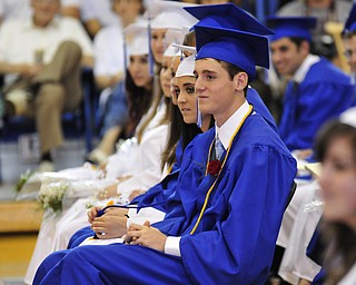 Poland senior Christopher Lipari and other seniors listen to the commencement speaker.