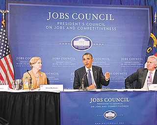 President Barack Obama speaks at the beginning of a meeting with the Jobs and Competitiveness Council at the corporate and U.S. manufacturing headquarters of Cree, a leading manufacturer of energy-efficient LED lighting. Monday, June 13, 2011, in Durham, N.C. Seated left of Obama is Ellen Kullman and right is Jeff Immelt, Chair, The President's Council on Jobs and Competitiveness. (AP Photo/Carolyn Kaster)