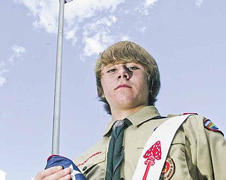 Eagle Scout candidate Greg Haylett, 16, said the lighted flagpole he’s planning to install at Poland Township Park will also serve as a 9/11 memorial. The pole behind him is at Poland United Methodist Church.