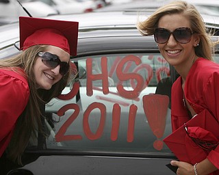 ROBERT K. YOSAY | THE VINDICATOR --..Stopping for a memory are Cally Wollet and Nikki Calai at Canfield High School 2011 graduation at the Stadium - .. -30-..(AP Photo/The Vindicator, Robert K. Yosay)