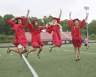 ROBERT K. YOSAY | THE VINDICATOR --..CELEBRATE - Katie Tiberio Nicole Tiberio Jenna George and Lauren Boucherle -celebrate together at Canfield High School 2011 graduation at the Stadium - .. -30-..(AP Photo/The Vindicator, Robert K. Yosay)