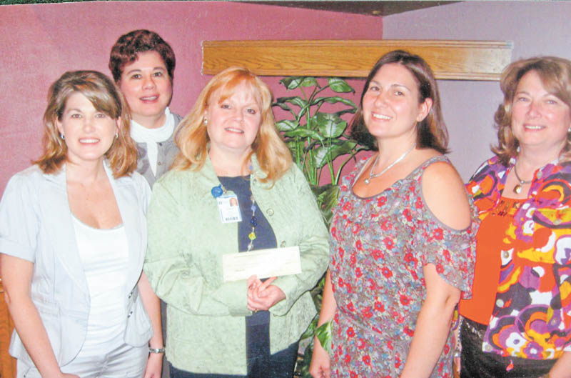 JoAnn Stock, director of development for Akron Children’s Hospital Mahoning Valley, holds a check donated by committee members of the Mahoning County Medical Society Alliance, from left to right, Cassie Calderon, Paula Jakubek, Tammy Engle and Carol Sankovic. Not pictured is committee member Shelly Barton. 