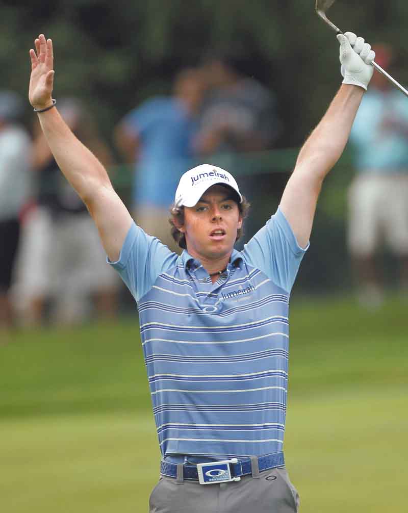 Rory McIlroy, of Northern Ireland, reacts to his eagle on the eighth hole during the second round of the U.S. Open Championship golf tournament in Bethesda, Md., Friday, June 17, 2011. (AP Photo/Mike Groll)