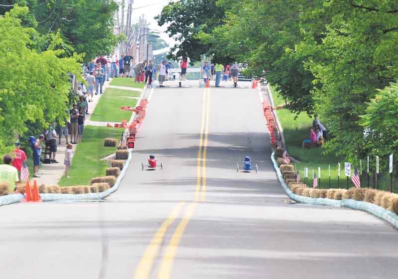 Soap box racers zip down West Main Street in Cortland. Area kids competed in the Greater Youngstown Area Soap Box Derby on Saturday for a chance to compete in the All-American Soap Box Derby Championships in Akron on July 23.