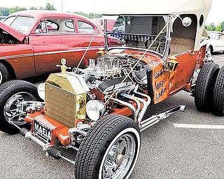 A hand-built 1927 Ford Model T bucket street rod with a 1963 327 Corvette engine, owned by Fred Rome of Youngstown, was one of 145 vehicles on display Sunday at the Beaver Township Father’s Day car show.
